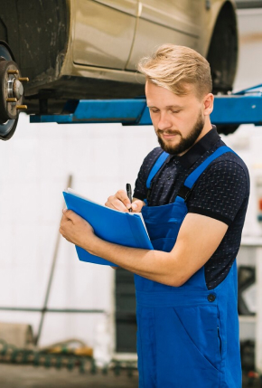 mechanic-checking-car-workshop_23-2147897933 1